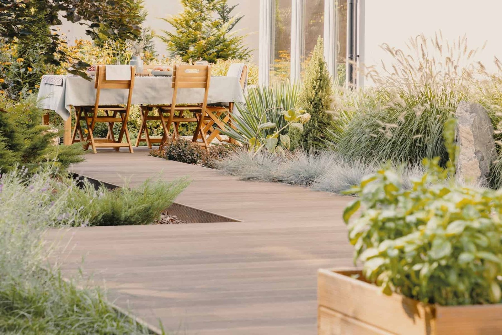 plants-and-wooden-chairs-at-table-with-food-on-ter-2023-11-27-05-10-41-utc